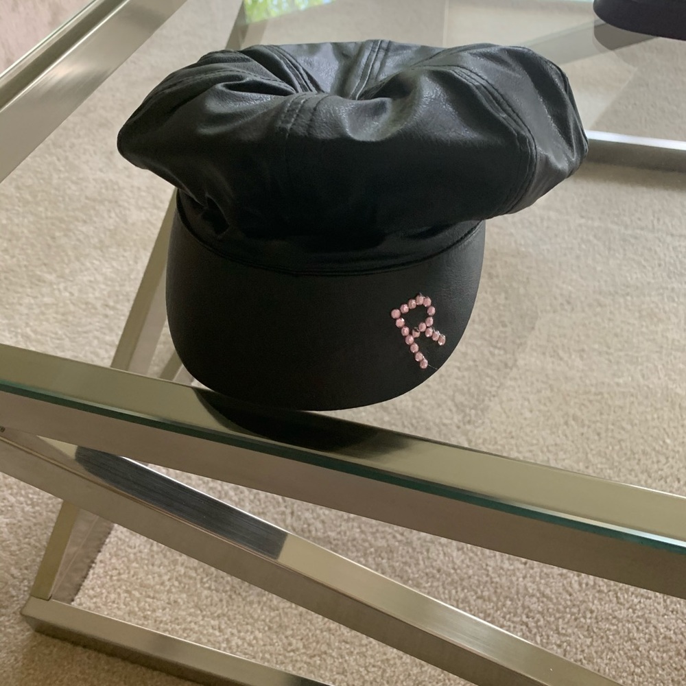 A black girls hat with letter R in rhinestones